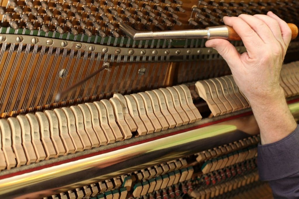 Piano tuner at work